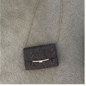 Also snake skin bag